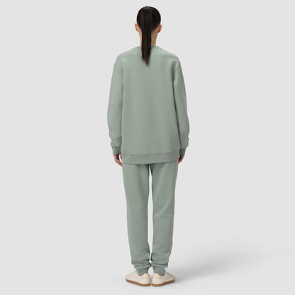 Back of model wearing green sage loungewear matching set