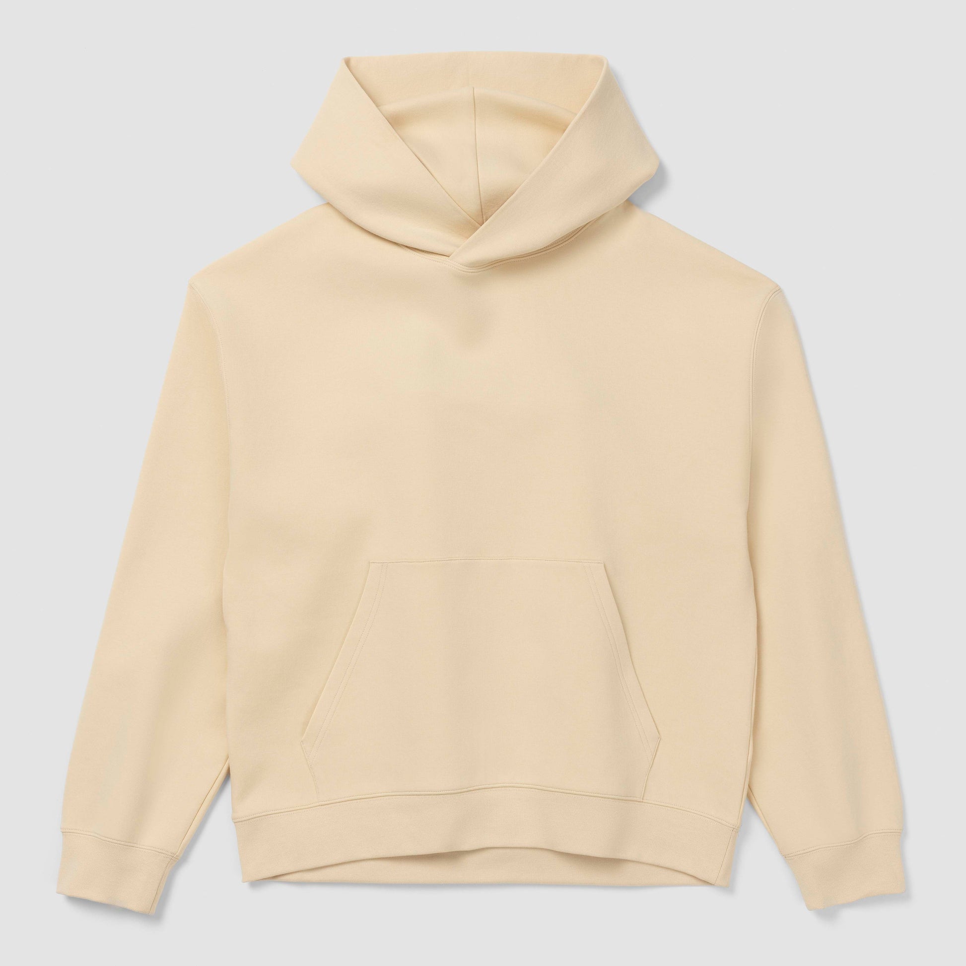 Sweat à capuche crème sur fond gris clair