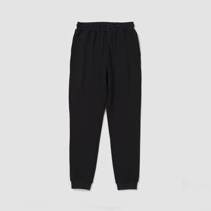 Black sweatpants on a light gray background