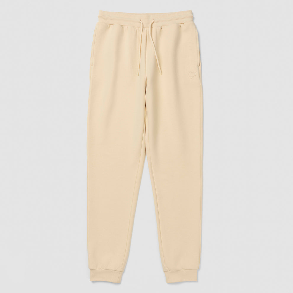 Pantalon de jogging crème avec cordon de serrage sur fond blanc