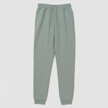 Jogger vert sauge clair sur fond blanc