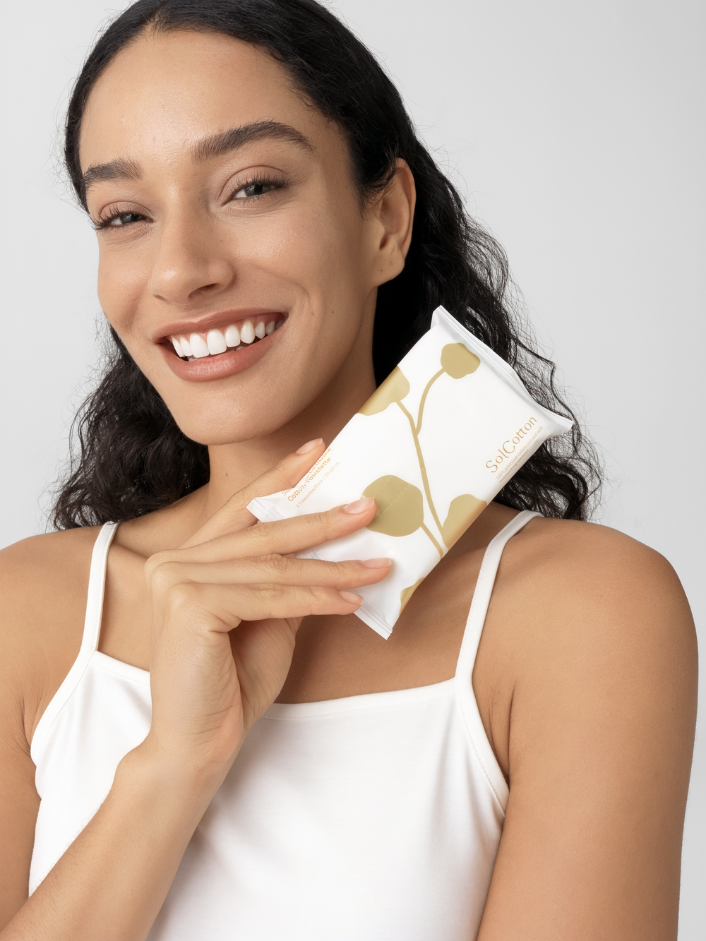 Woman holding la divine travel with a white background