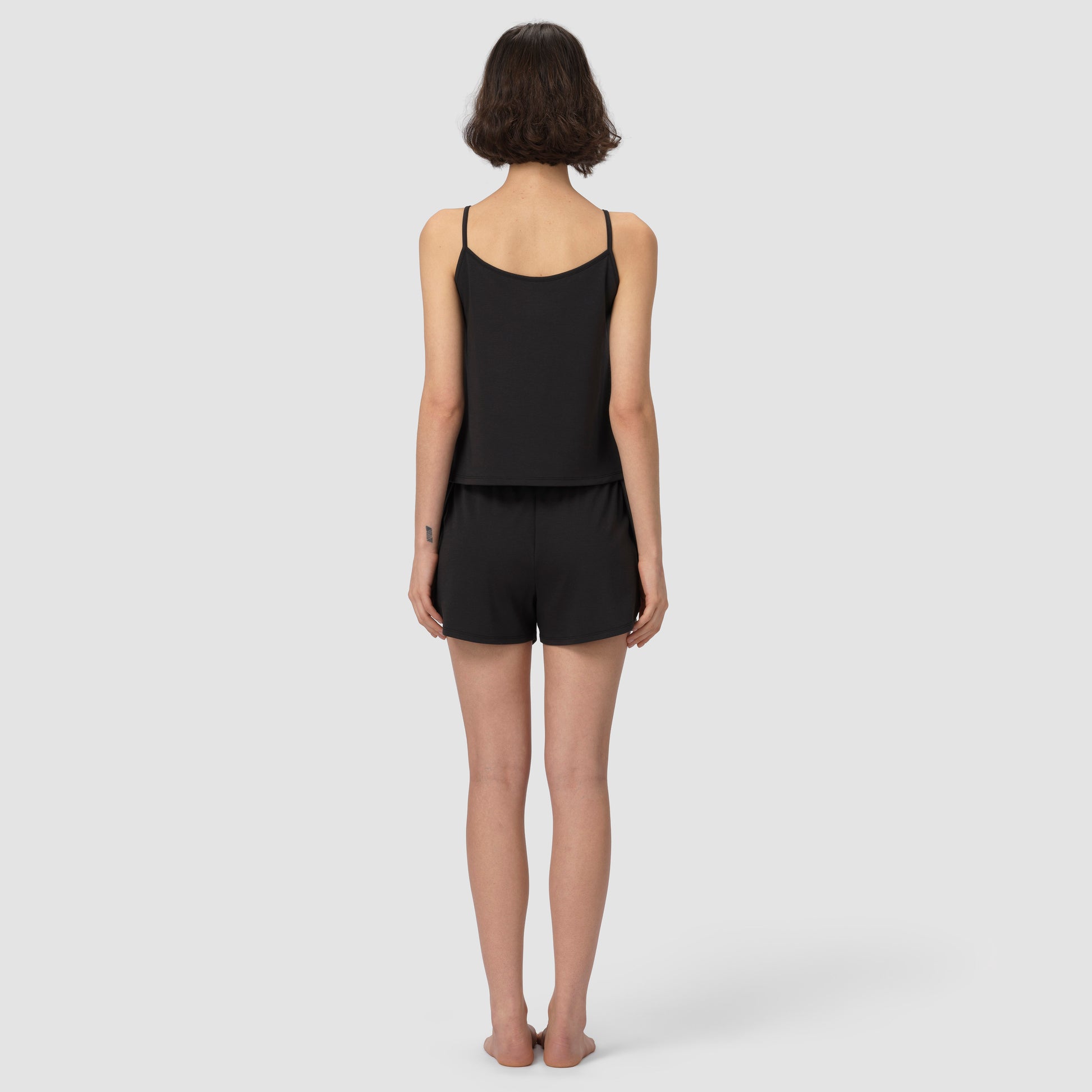 Back of a model wearing black pajama set