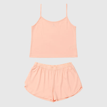 Salmon camisole and shorts set on a light gray background