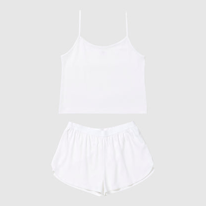 White tank top and shorts pajama set on a light gray background