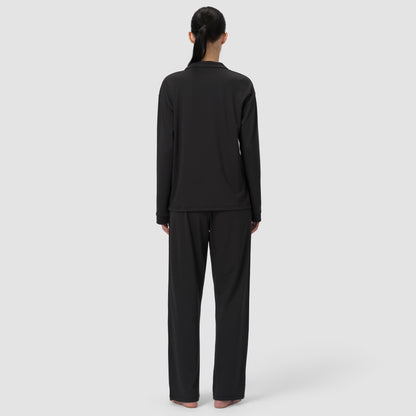 Back shot of black pajama Ava Classic worn by model