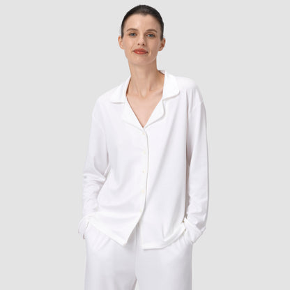 Ava Classic pajama set in white with model smiling on a plain background