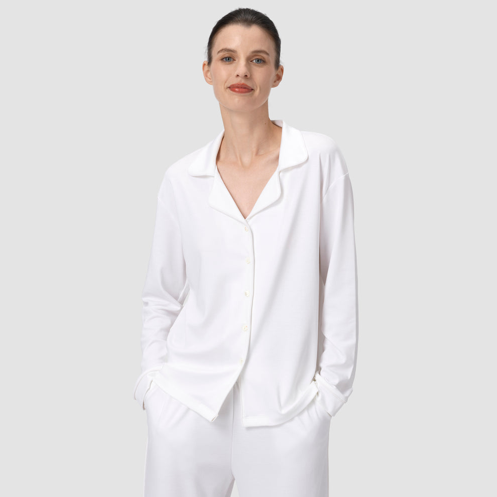 Ava Classic pajama set in white with model smiling on a plain background