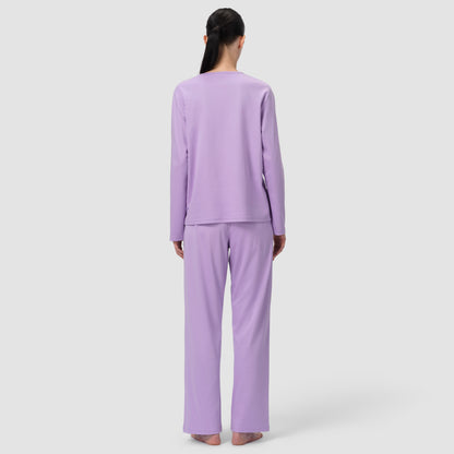Back of model wearing long pajama et in lavender color