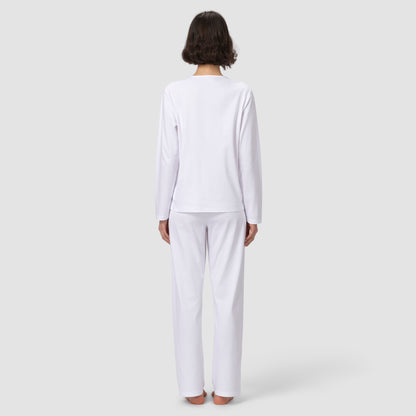Back of model wearing long white pajama set