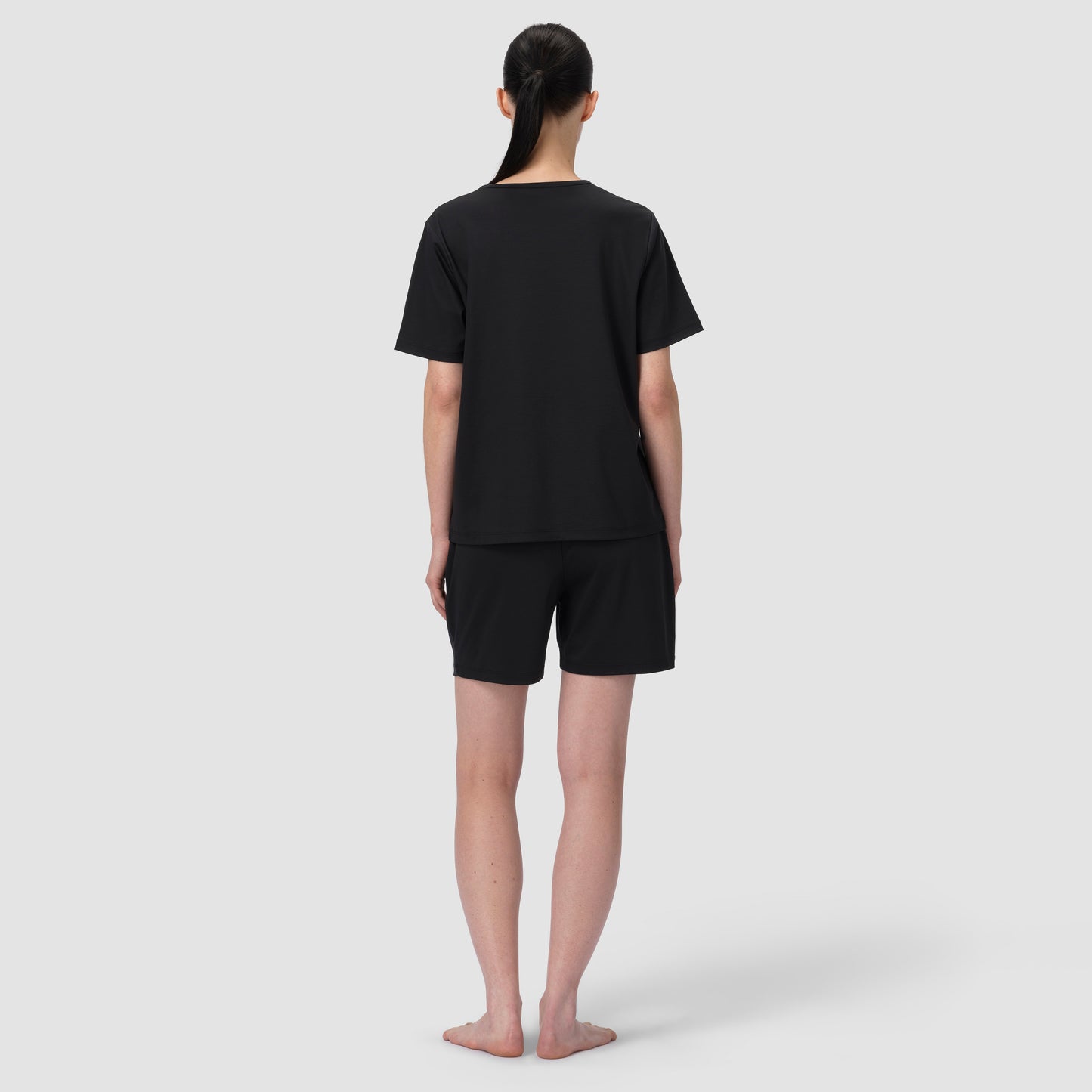 Back of model wearing short black pajama