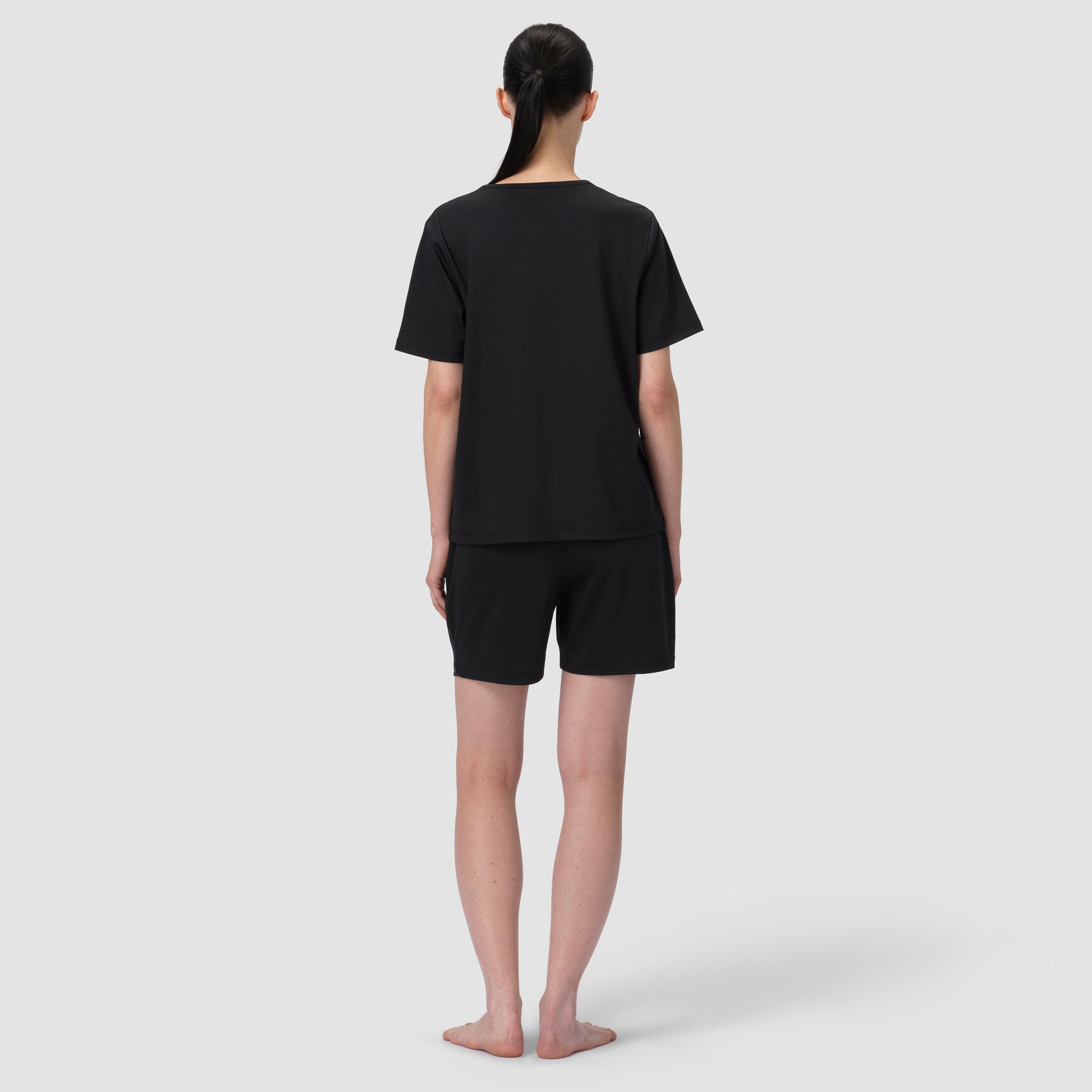 Back of model wearing short black pajama