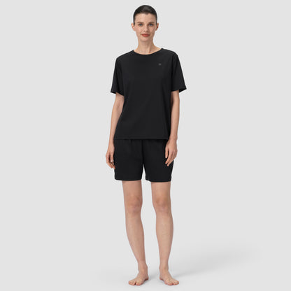 Front full feet shot of model wearing black pajama matching set