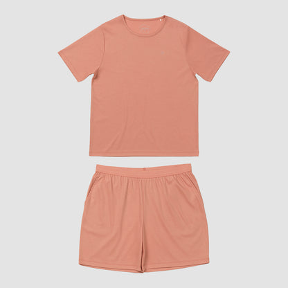 Orangy pink t-shirt and shorts set on a light gray background