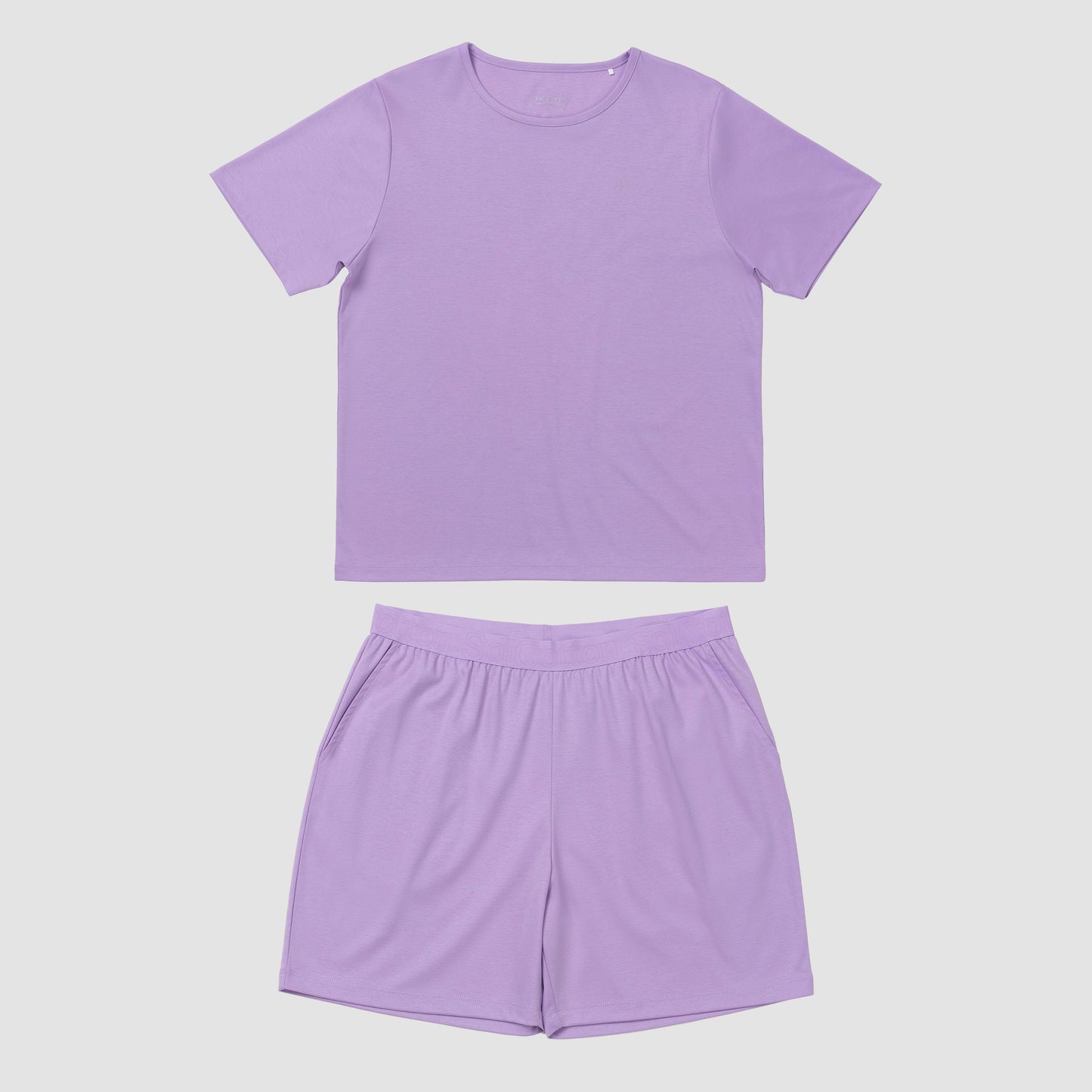 Lavender pajama set on a plain grey background