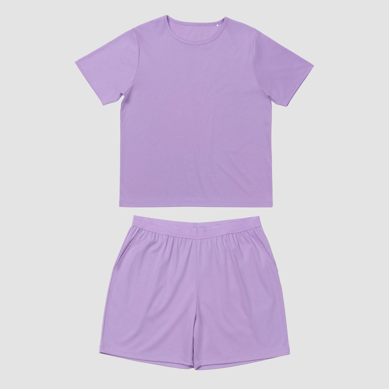 Lavender pajama set on a plain grey background