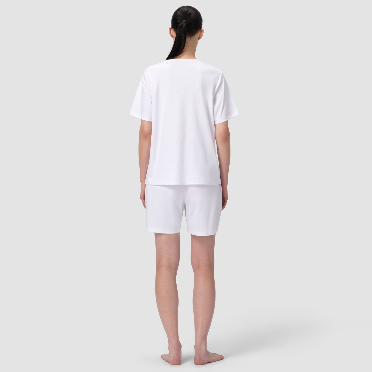 Back of model wearing white pajma matching set