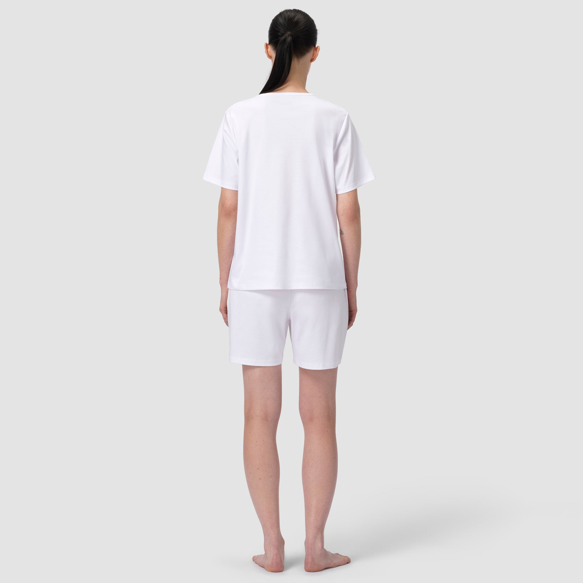 Back of model wearing white pajma matching set