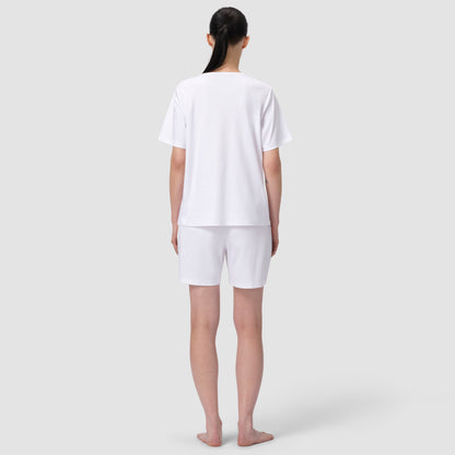 Back of model wearing white pajma matching set