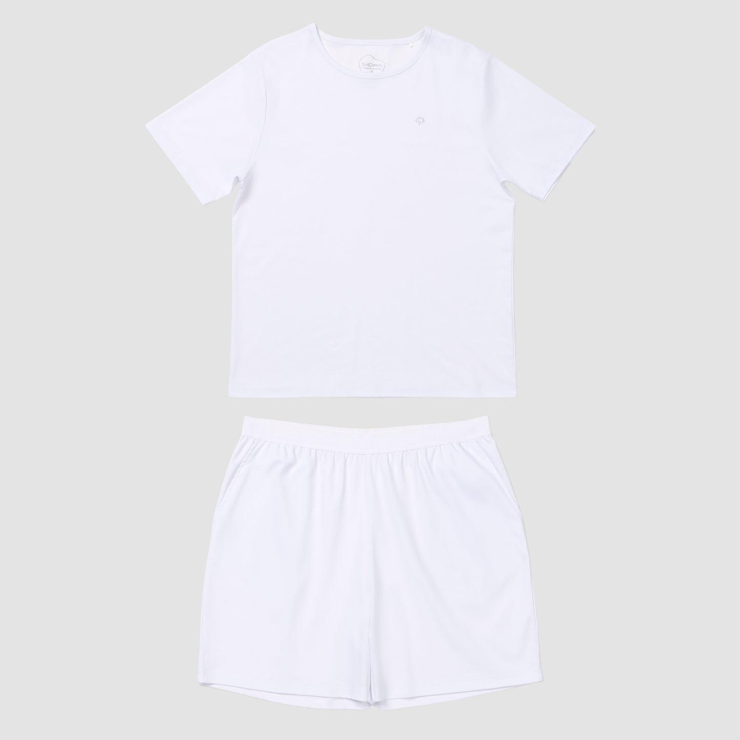 White t-shirt and shorts set on a light gray background