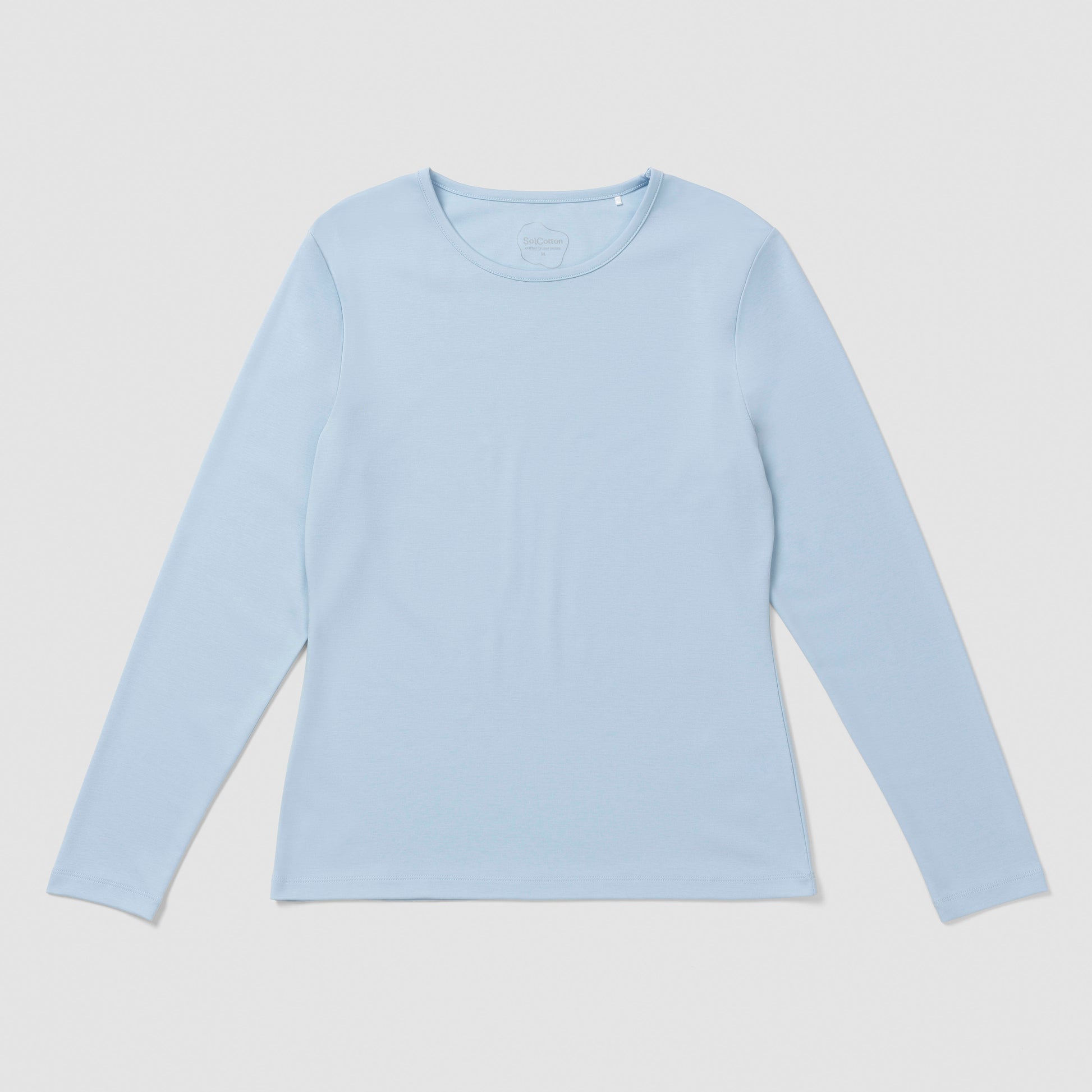 Light blue long-sleeve shirt on a light gray background