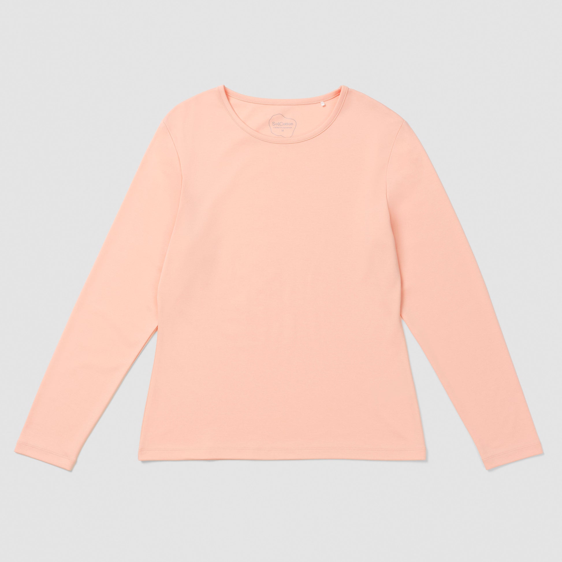 Salmon long-sleeve shirt on a light gray background