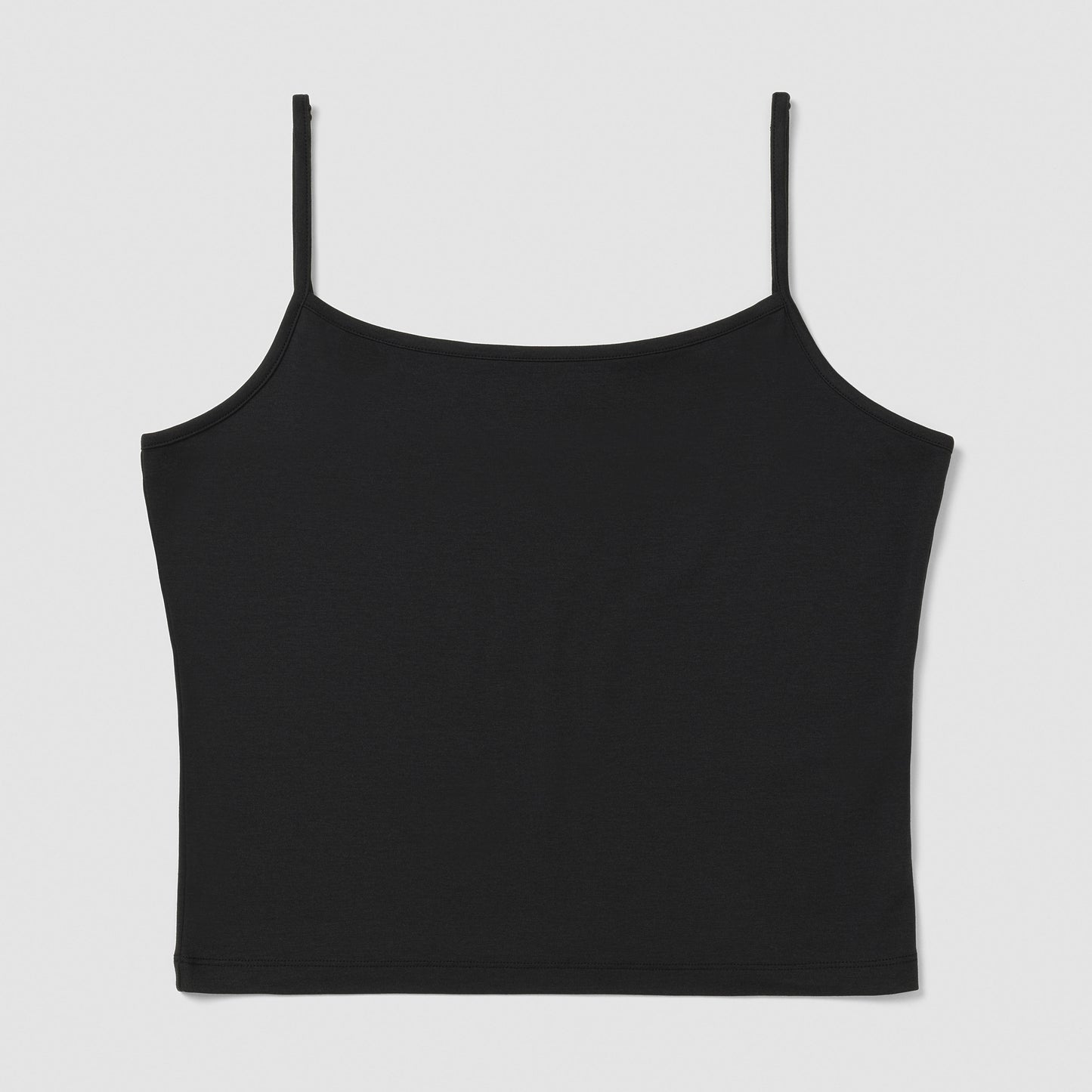 Black spaghetti strap top on a light gray background