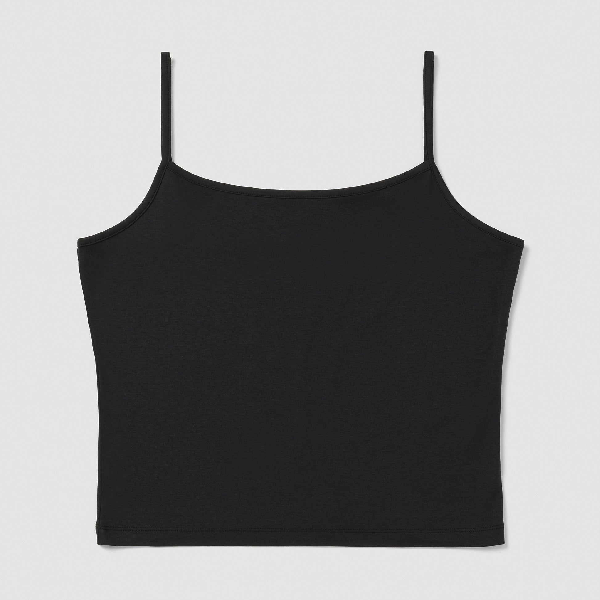 Black spaghetti strap top on a light gray background