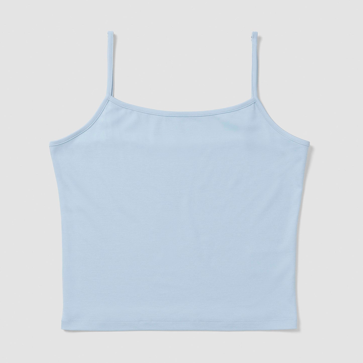 Light blue camisole on a light gray background