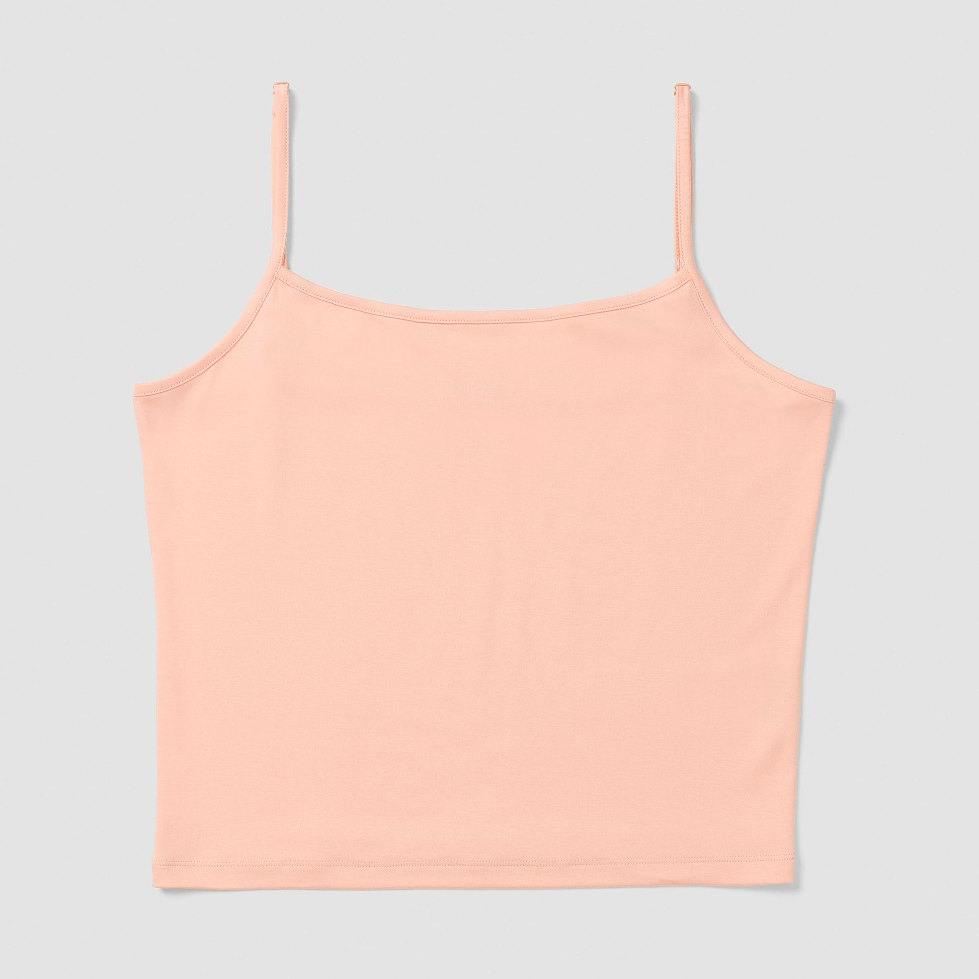 Salmon camisole top on a light gray background