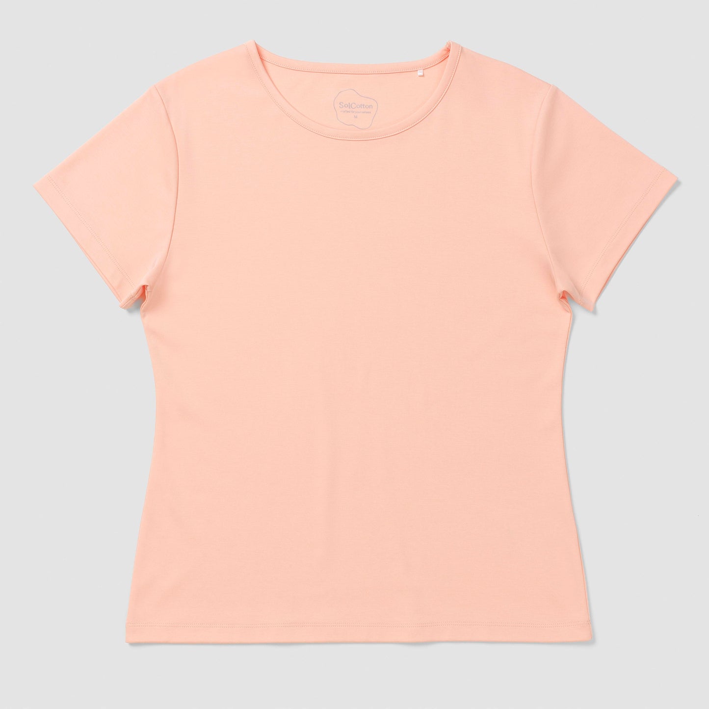 Light salmon pink t-shirt on a light gray background