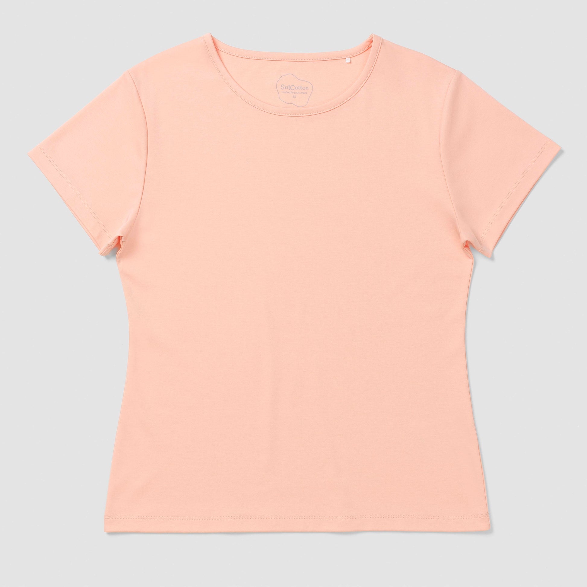 Light salmon pink t-shirt on a light gray background