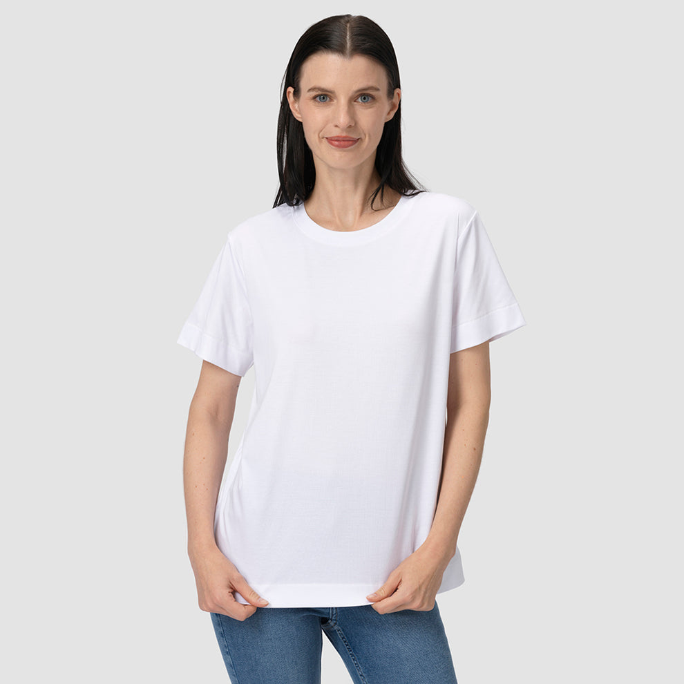 Woman wearing a plain white t-shirt and blue jeans on a light gray background
